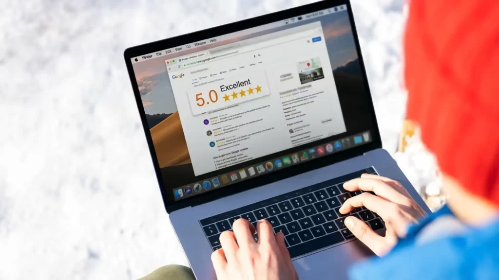 Google review requests — business owner sending personalised review request email to current client on desktop computer